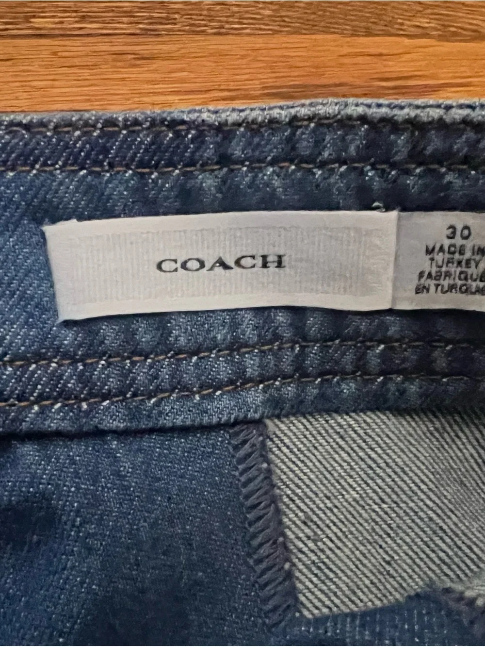 Coach Turnlock Denim Mini Skirt